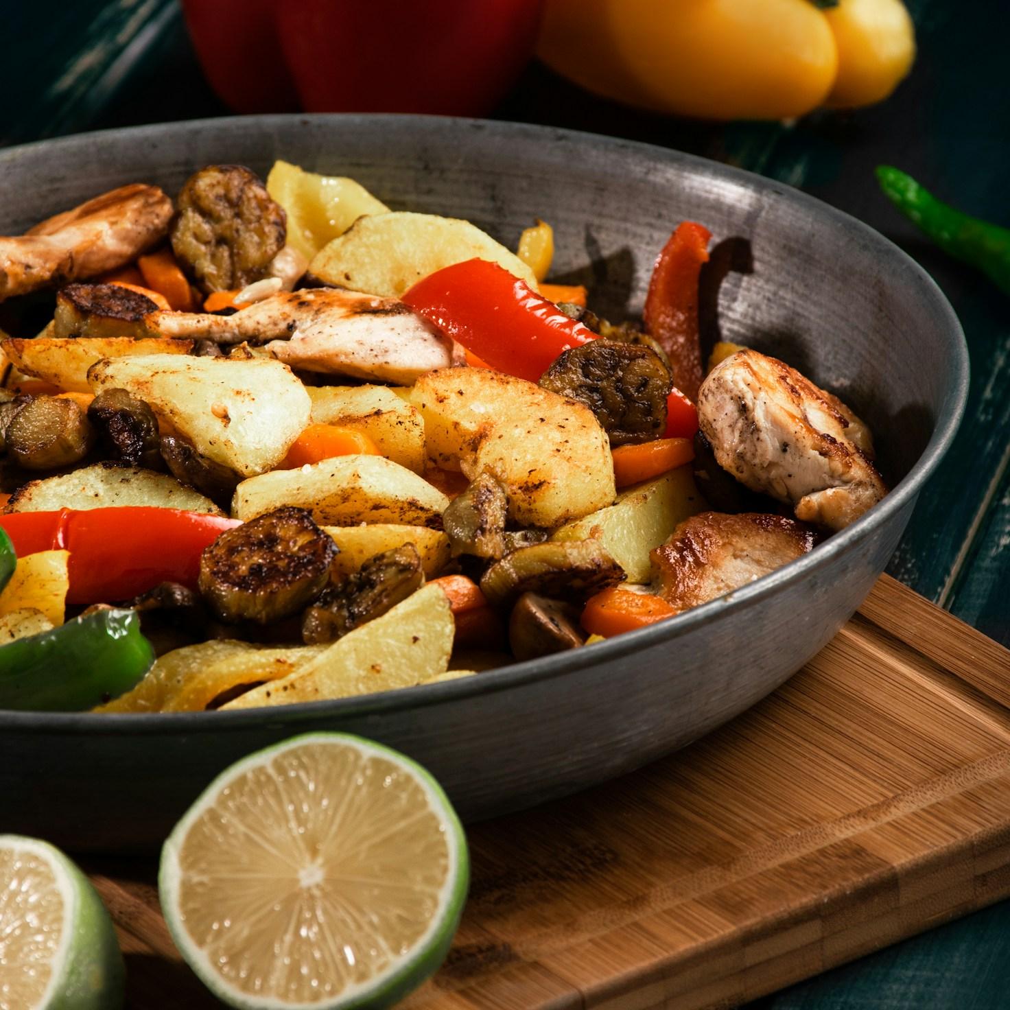 Members collaborating in a contemporary kitchen, exchanging recipes and techniques